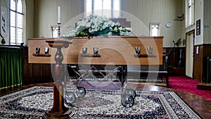 Closeup shot of a colorful casket in a hearse or chapel before funeral or burial at cemetery