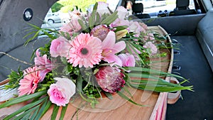 Closeup shot of a colorful casket in a hearse or chapel before funeral or burial at cemetery