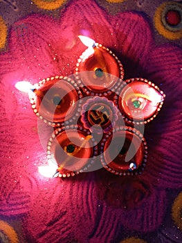 closeup shot of colorful handmade earthen lamps lit during the Deepawali festival