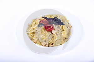 Closeup shot of a creamy farfalle pasta on a white plate