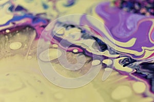 Closeup shot of a creative background with abstract acrylic painted colorful patterns