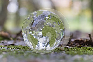 Closeup shot of a crystal ball with the map of the world