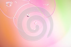 Closeup shot of cute bubble formations with rainbow-colored background