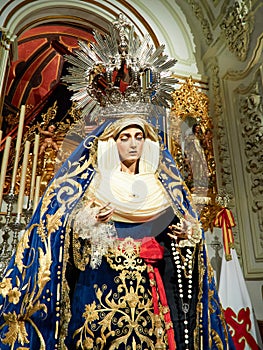 Closeup shot of a decorated church with the statue of Virgin Mary, crown on her head