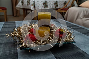 Closeup shot of a decorative table piece with candles photo