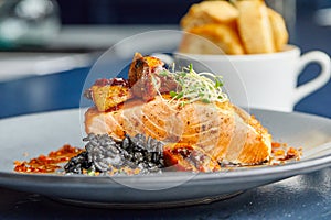 Closeup shot of a delicious salmon with vegetable sidedish