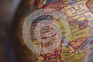 Closeup shot of different countries on the globe with a blurred background