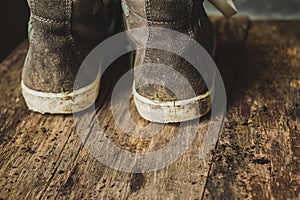 Closeup shot of dirty children`s boots