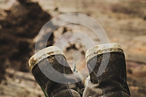 Closeup shot of dirty children`s boots