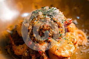 Closeup shot of a dish of gourmet Shrimp Aglio Olio pasta