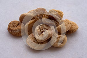 Closeup shot of dried figs on a white surface