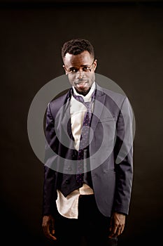 Closeup shot of drunk Afro businessman with ragged clothes