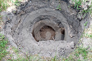 Closeup shot of dug up hole in the ground