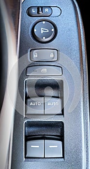 Closeup shot of an electric car door control panel