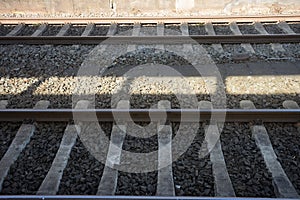 Closeup shot of an empty railway track and stone way