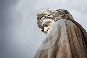 Closeup shot of the famous white marble monument of Dante Alighieri in Florence photo