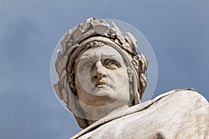 Closeup shot of the famous white marble monument of Dante Alighieri photo