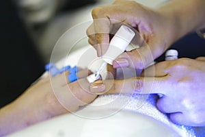 Closeup shot of female foot fingers during a manicure