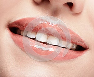 Closeup shot of female smiling mouth with red lips