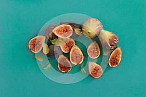 Closeup shot of fig fruits in a cut on reen background