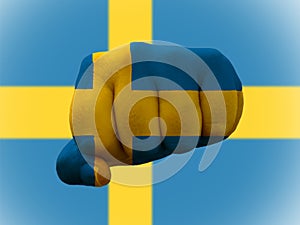 Closeup shot of a flag of Sweden painted on male fist