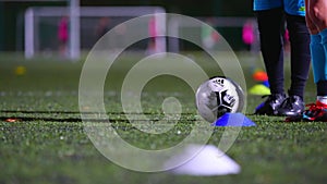 closeup shot of a football player getting ready to kick a soccer ball, stadium, sportswear, active life