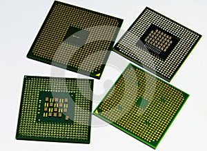 Closeup shot of four laptop processors on the white background