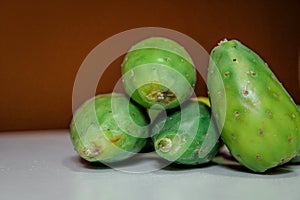 Closeup shot of fresh mangos on a brown background