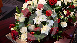 Closeup shot of a funeral casket in a hearse or chapel or burial at cemetery