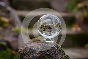 Closeup shot of a glass sphere on the rock