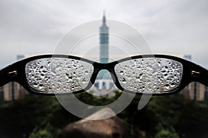 Closeup shot of glasses covered with water drops on a blurred background in Taipei, Taiwan