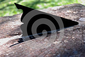 Closeup shot of a gnomon of a sundial on an old rusted metal surface