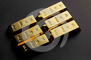 Closeup shot of gold bars on a black