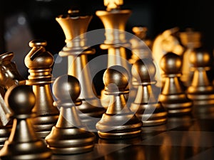 Closeup shot of golden chess figures on the chessboard