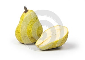 Closeup shot of a green juicy pear and halved pear isolated on a white background