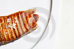 Closeup shot of a grilled beef tenderloin steak isolated on a white background