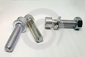 Closeup shot of a group of bolt and nut on white background