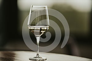 Closeup shot of a half-full white wine glass