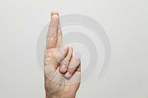 Closeup shot of a hand gesture on white background