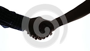 Closeup shot of hand shake man and woman in silhouette, Black and white