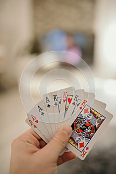 Closeup shot of hands holding playing cards