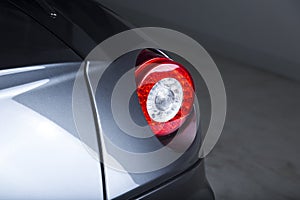 Closeup shot of the headlights of a modern silver car