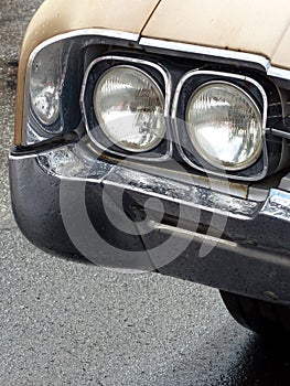 Closeup shot of the headlights of a vintage car