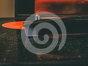 Closeup shot of a headshell of modern gramophone with a blurred in the background