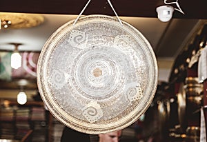 Closeup shot of Hindu gong with patterns and a blurred background