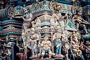 Closeup shot of Hindu ornaments and a group of Deity statues of a Hindu temple in Singapore