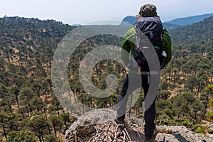 A closeup shot of a Hispanic hiker on top of mount Tlaloc in Mexico
