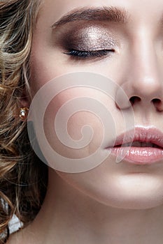 Closeup shot of human female face. Woman with closed eyes