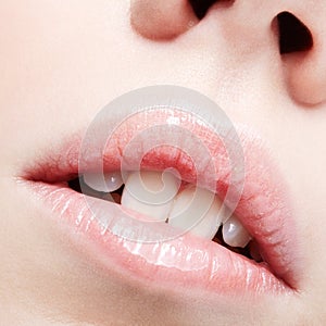 Closeup shot of human female face. Woman with pink plump lips makeup