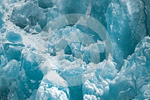 Closeup shot of the ice texture of a blue glacial wall in Inside Passage, Alaska